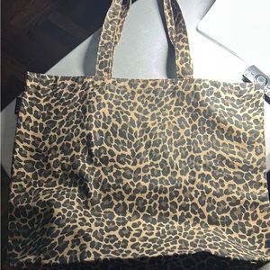 The is a J crew canvas tote bag leopard print